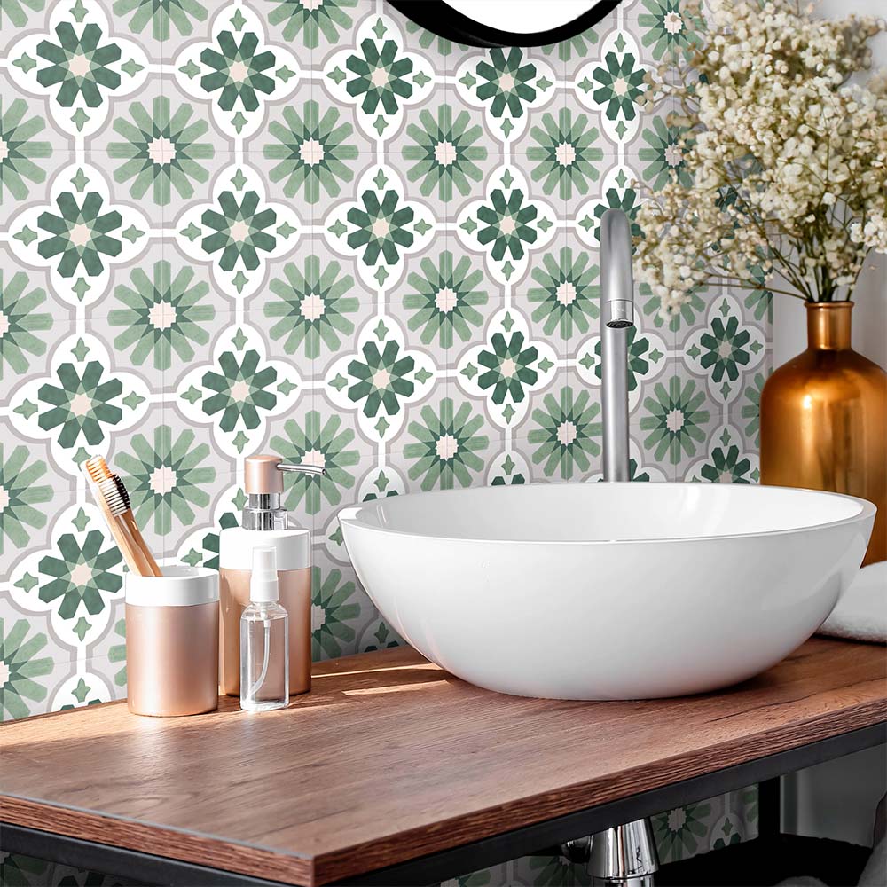 Bathroom featuring Clara Jade Mini Victorian Moroccan-style porcelain tiles in a 15 × 15cm format, creating a decorative patterned splashback behind a countertop basin with warm wood accents.
