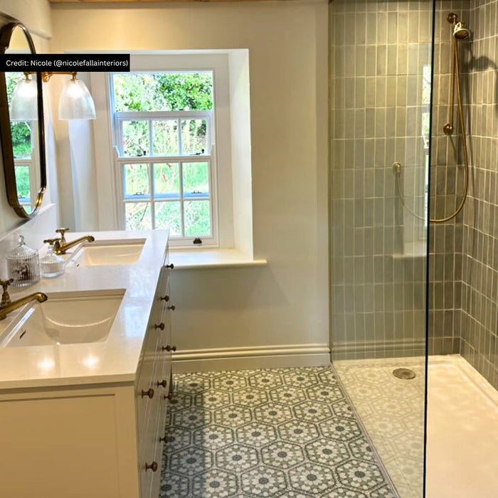 Bathroom featuring Medina Soft Green Moroccan-style hexagon porcelain floor tiles, 18.7 × 21.6 cm, laid in a repeating geometric pattern alongside a walk-in shower and classic vanity units.