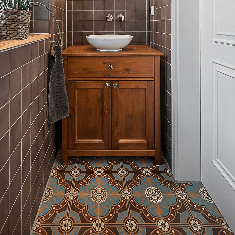 Bathroom interior featuring London Streets Hanover Square 20x20cm Victorian Moroccan style floor tiles, styled with a wooden vanity unit, round basin sink and brown wall tiles, creating a warm, characterful patterned bathroom floor.