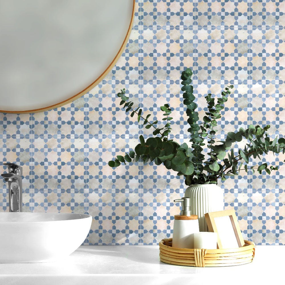 Bathroom wall featuring Berber Mequinez Blue 15×15cm Moroccan-style porcelain tiles, showcasing a blue and cream geometric pattern styled with a countertop basin and greenery.