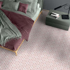 Bedroom featuring Medina Hormuz Rose Moroccan-style hexagon porcelain floor tiles, 18.7 × 21.6 cm, laid in a star-inspired geometric pattern and styled with soft pink bedding and contemporary furniture.