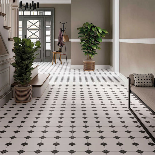Hallway featuring Belvoir Black 33 × 33cm Victorian style porcelain floor tiles, creating a classic geometric pattern with black and white contrast. Paired with neutral walls and traditional details for a timeless, elegant finish.