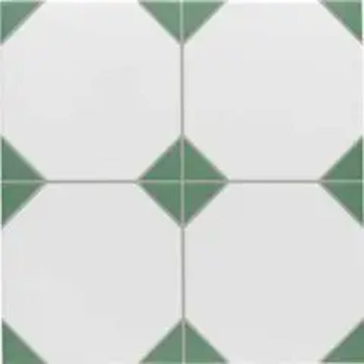 Close-up of Belvoir Green 33 × 33cm Victorian style porcelain floor tiles, showcasing a classic white base with soft green geometric detailing. Ideal for creating timeless patterned floors in hallways, kitchens, or bathrooms.