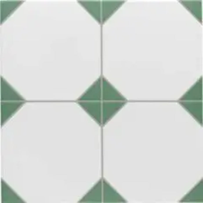 Close-up of Belvoir Green 33 × 33cm Victorian style porcelain floor tiles, showcasing a classic white base with soft green geometric detailing. Ideal for creating timeless patterned floors in hallways, kitchens, or bathrooms.
