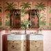 Bathroom featuring Benomar Pink Moroccan Mini Brick Matt 5x15cm wall tiles in a herringbone layout, styled with tropical palm wallpaper, carved wood mirrors, and marble-effect basins for a luxurious eclectic interior.