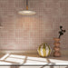 Kitchen featuring Berber Mequinez Rose 15cm x 15cm Moroccan style tiles across the walls and floor, showcasing a delicate pink geometric pattern with soft tonal variation, paired with neutral cabinetry, marble worktops and warm natural accessories.