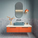 Bathroom featuring Berber Tetuan Blue 15cm x 15cm Moroccan style patterned tiles across the walls and floor, showcasing an intricate blue and white design, paired with a blue basin, orange vanity and coordinating statement lighting.