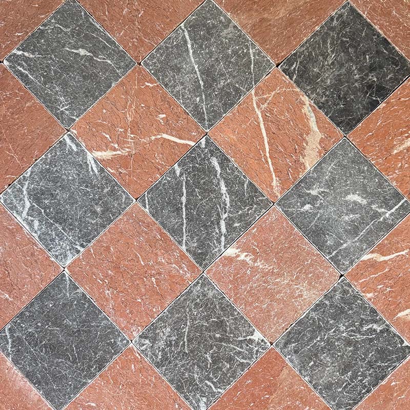 Chequerboard layout featuring Fayrouz Black 15.2x15.2cm natural marble tiles with a tumbled finish, paired with Rosso marble tiles, installed diagonally to create a warm, high-contrast floor with rich natural veining.