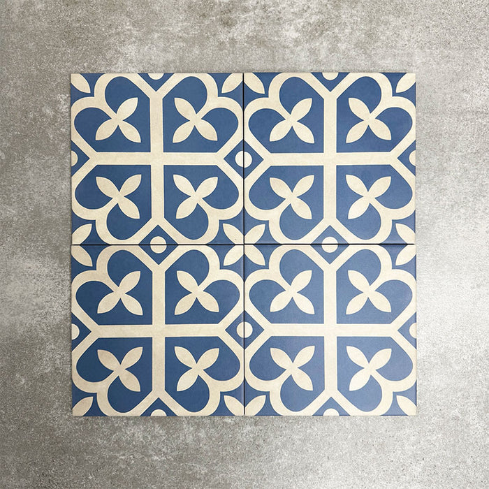 Ivy Blue Victorian Moroccan style 20x20cm patterned tiles, shown as four tiles together to highlight the repeating blue and white geometric pattern.