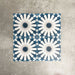 Souk Blue B 20×20cm Moroccan-style porcelain tiles arranged in a blue, white and grey geometric pattern.
