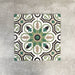 Four London Streets Bond Street 20x20cm Victorian Moroccan style porcelain tiles arranged together to showcase the repeating geometric pattern in green, black and cream tones inspired by traditional Victorian style decorative floor tiles.