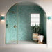Contemporary walk-in shower featuring Bora Bora Aqua Square 10cm x 10cm flux glaze wall tiles, paired with white floor tiles, brass shower fittings and an arched alcove for a bright Mediterranean-inspired bathroom.