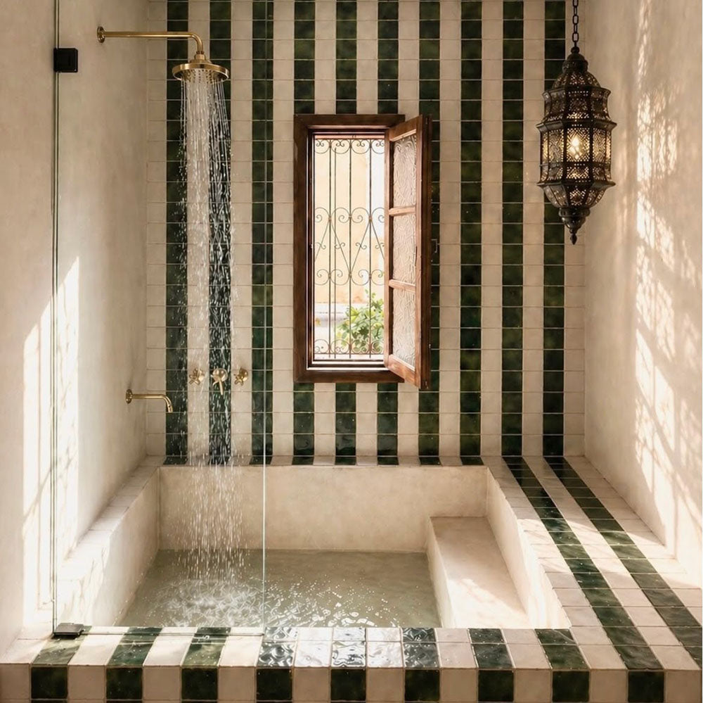 Moroccan style bathroom featuring Bora Bora Green Square 10cm x 10cm wall tiles, paired with white square tiles in a striped design around a sunken bath and shower area.