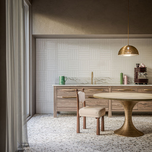 Kitchen featuring Bora Bora White Sand Brick 6.5x32.8cm wall tiles with a flux glaze finish, arranged in a basketweave pattern, paired with natural wood cabinetry, marble-effect worktops and brass accents.