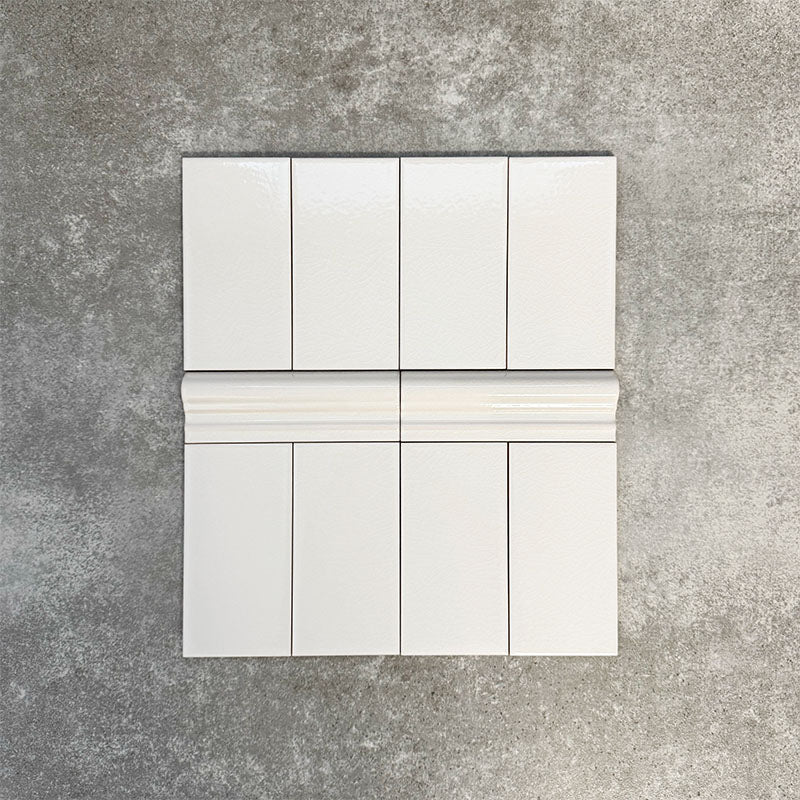 Pimlico White 7.5 × 15cm ceramic wall tiles with a crackle glaze finish, combined with matching 5 × 15cm dado trim to create a decorative horizontal feature that adds classic detail to wall designs.