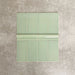 Pimlico Lime Green 7.5 × 15cm ceramic wall tiles with a crackle glaze finish, combined with matching 5 × 15cm dado trim to create a decorative horizontal feature, adding depth and classic detail to wall designs.
