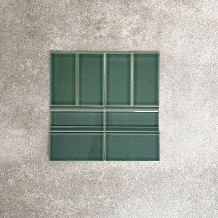 Pimlico Golders Green 7.5 × 15cm ceramic wall tiles with a crackle glaze finish, paired with matching 15 × 15cm skirting tiles to create a classic brick layout with a decorative base detail.