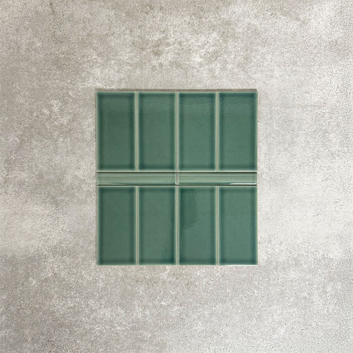 Pimlico Golders Green 7.5 × 15cm ceramic wall tiles with a crackle glaze finish, paired with matching 2.5 × 15cm pencil trim to create a classic brick layout with a subtle decorative detail.