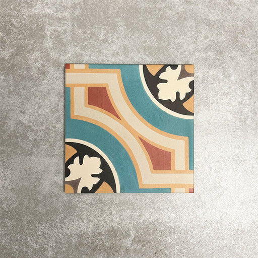 Single London Streets Carnegie Hall 20x20cm Victorian Moroccan style porcelain tile displayed in a product setting, featuring an intricate geometric pattern in teal, cream, terracotta and black tones inspired by traditional decorative floor tiles.