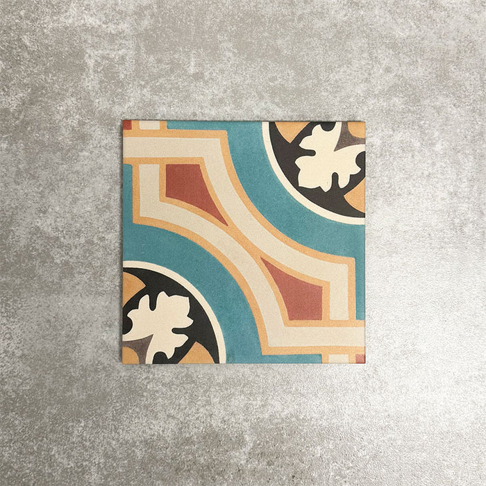 Single London Streets Carnegie Hall 20x20cm Victorian Moroccan style porcelain tile displayed in a product setting, featuring an intricate geometric pattern in teal, cream, terracotta and black tones inspired by traditional decorative floor tiles.