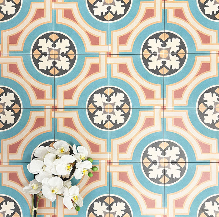 Group of London Streets Carnegie Hall 20x20cm Victorian Moroccan style porcelain tiles arranged together to showcase the repeating geometric pattern in teal, cream, terracotta and black tones, styled with white flowers for a decorative flat-lay setting.