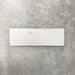 Close-up of Foundry Bricks Chalk White 6.5x20cm brick wall tile, showcasing soft off-white tones with subtle tonal variation, lightly textured surface and gently irregular edges for a refined, contemporary finish.
