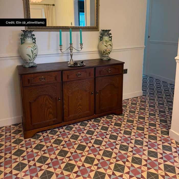 Hallway featuring Chatsworth Manor Victorian style 20cm x 20cm patterned floor tiles in red, blue, cream and black, paired with antique wooden furniture, decorative ceramics and traditional interior details.