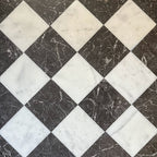 Chequerboard layout featuring Fayrouz White 15.2x15.2cm natural marble tiles with a honed finish, paired with black marble tiles, installed diagonally.