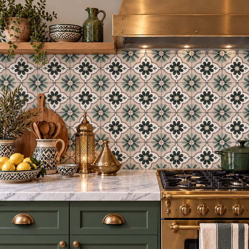 Kitchen featuring Clara Jade Mini 15x15cm Victorian and Moroccan-style patterned splashback tiles, with intricate jade green, white and grey floral motifs, paired with dark green cabinetry, marble-effect worktops, brass fittings and natural wooden accessories.