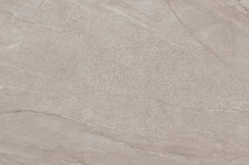 Flat lay of Comet Earth Stone 2cm 60 × 90cm porcelain tile, highlighting soft beige stone effect tones with delicate veining and fine surface texture. Subtle variation creates a calm, natural look suited to both indoor and outdoor spaces.
