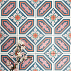 Group of London Streets Conduit Street 20x20cm Victorian Moroccan style porcelain tiles arranged to display the repeating pink, teal and terracotta geometric pattern, styled with delicate flowers in a decorative flat-lay setting.