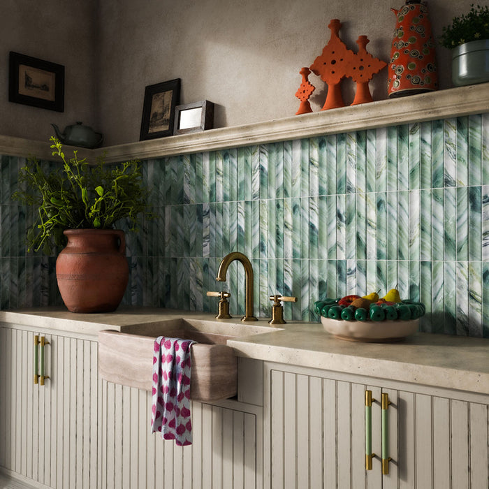 Kitchen featuring Crete Fluted Jade Matt 11.5x23cm green marble-effect wall tiles with fluted detailing, styled with rustic cabinetry, brass fixtures, natural stone worktops, and Mediterranean-inspired décor.