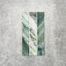 Product display of Crete Fluted Jade Matt 11.5x23cm wall tiles in green marble-effect tones, featuring fluted detailing with layered natural veining against a textured concrete-style backdrop.