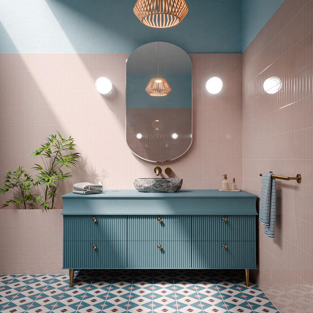 Cuba Guazzatto 20cm x 20cm Moroccan style patterned tiles, featuring a geometric design in teal, soft pink, burgundy and white across the bathroom floor, paired with blush pink wall tiles and a teal vanity.