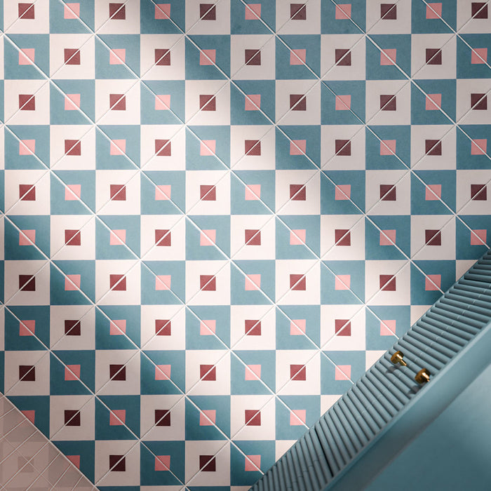 Cuba Guazzatto 20cm x 20cm Moroccan style patterned tiles, featuring a repeating geometric design in teal, white, soft pink and burgundy, creating a bold and playful bathroom floor.