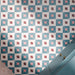 Cuba Guazzatto 20cm x 20cm Moroccan style patterned tiles, featuring a repeating geometric design in teal, white, soft pink and burgundy, creating a bold and playful bathroom floor.