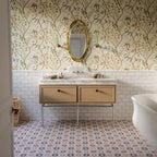 Floor featuring Cuba Manzanillo 20cm x 20cm Moroccan style patterned tiles, showcasing an intricate geometric design in pink, green, burgundy and warm neutral tones, creating a colourful statement beneath classic cabinetry.