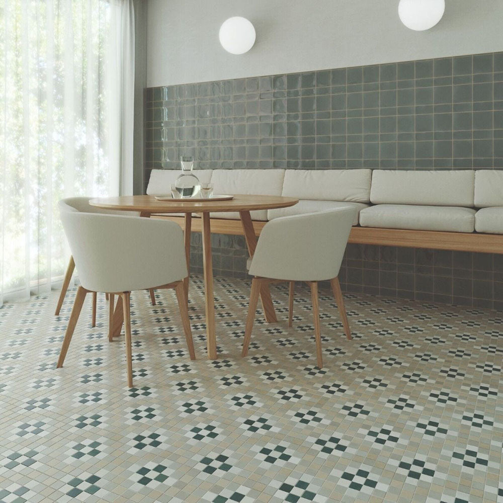 Dining area floor featuring Abbey Board 28×28cm Victorian-style patterned porcelain mosaic tiles in a soft neutral colour palette.