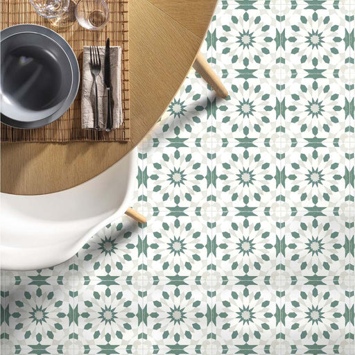 Dining area floor featuring Souk Green A 20×20cm Moroccan-style porcelain tiles with a green and white geometric pattern.
