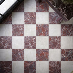 Divine Levant Rouge Matt 30cm x 30cm marble effect floor tiles, creating a bold burgundy and white chequerboard pattern with detailed veining for a richly layered, statement finish.
