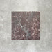 Close-up of Divine Levant Rouge matt marble-effect tile in a 30cm x 30cm format, featuring deep burgundy and rich red tones with intricate white and grey marble-inspired veining. The bold natural stone effect and dramatic colour variation create a luxurious statement finish, ideal for chequerboard floor designs, feature areas and characterful interior spaces.