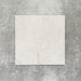 Close-up of Divine Taj Mahal matt marble-effect tile in a 30cm x 30cm format, featuring soft ivory and warm cream tones with subtle natural stone-inspired movement. The understated marble effect creates a timeless and elegant finish, making it ideal for chequerboard floor designs, bathrooms, hallways and sophisticated interior spaces.