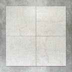 Close-up of Divine Taj Mahal matt marble-effect tile in a 30cm x 30cm format, featuring soft ivory and warm cream tones with subtle natural stone-inspired movement. The understated marble effect creates a timeless and elegant finish, making it ideal for chequerboard floor designs, bathrooms, hallways and sophisticated interior spaces.