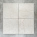 Close-up of Divine Taj Mahal matt marble-effect tile in a 30cm x 30cm format, featuring soft ivory and warm cream tones with subtle natural stone-inspired movement. The understated marble effect creates a timeless and elegant finish, making it ideal for chequerboard floor designs, bathrooms, hallways and sophisticated interior spaces.