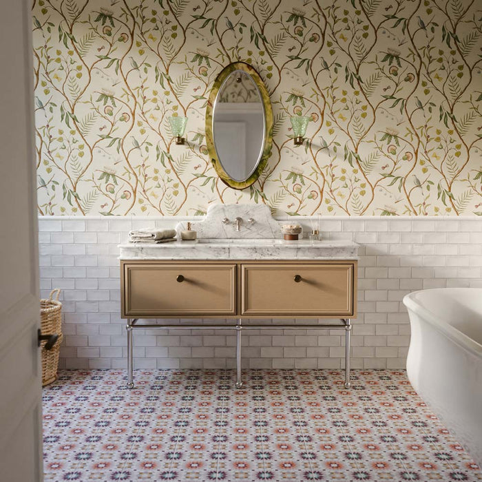 Bathroom featuring Dordogne White Blanca Bullnose Pencil Border Tiles 3cm x 20cm, creating a neat finishing detail above white wall tiles, paired with patterned floor tiles, botanical wallpaper, a marble vanity and classic fixtures.