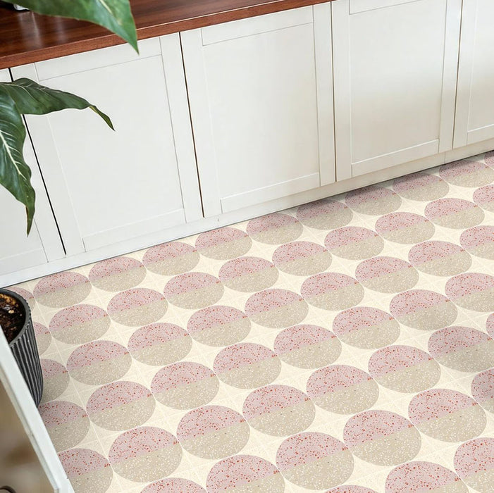 Kitchen featuring Eclipse Rosa 20x20cm terrazzo-style patterned floor tiles, paired with white shaker cabinetry and warm wood worktops for a soft contemporary interior with playful geometric detailing.