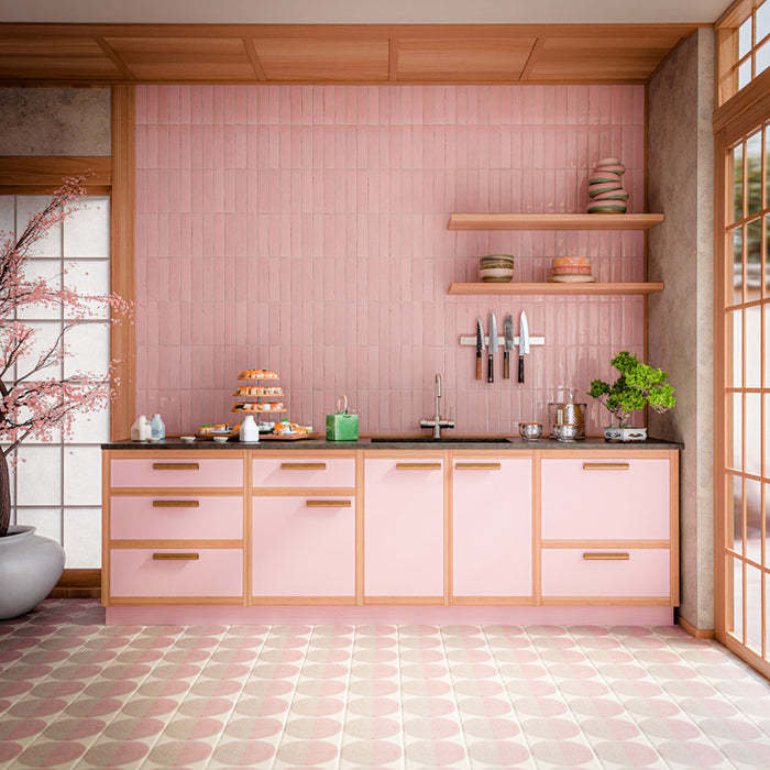 Interior featuring Eclipse Rosa terrazzo effect patterned tiles, combining soft blush pink and warm neutral tones in a striking circular geometric design. Paired with pink cabinetry, natural wood accents and delicate Japanese-inspired styling, this space creates a playful yet sophisticated look that feels bright, contemporary and full of personality. The repeating pattern adds movement and visual interest while maintaining a soft, elegant colour palette.