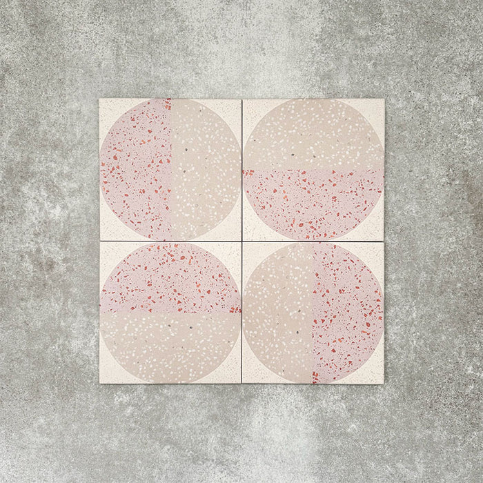 Eclipse Rosa 20x20cm terrazzo-style decor tiles featuring a soft geometric circle design in blush pink and warm neutral tones, creating a playful yet contemporary patterned floor or wall finish.