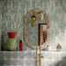 Bathroom featuring Eclipse Salvia 20x20cm terrazzo-effect patterned wall and floor tiles, styled with a freestanding stone bath, green marble-effect brick tiles, brushed brass fixtures and botanical-inspired contemporary décor.