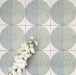 Eclipse Salvia 20x20cm terrazzo-style decor tiles featuring a soft sage and pale blue circular pattern, designed to bring a playful yet calming geometric look to contemporary interiors.